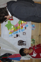 José showing me his geography and giving me the names of the animals in English