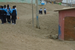 State school have a PE lesson outside on the road. Look at the cones - that't it.