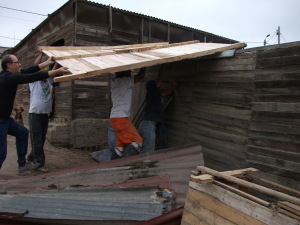 Maria's new roof going on with Carlos, Segundo, Elisban