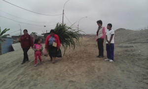 walking back to school with R - lady carrying animal food